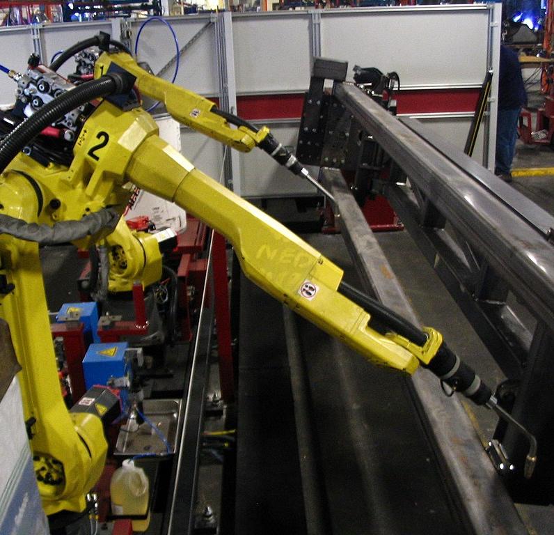 Welding robots in use in a factory