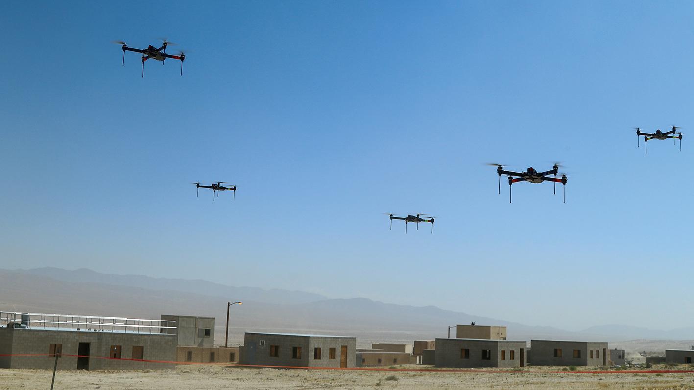 A swarm of quadcopter drones taking part in a US Army military exercise