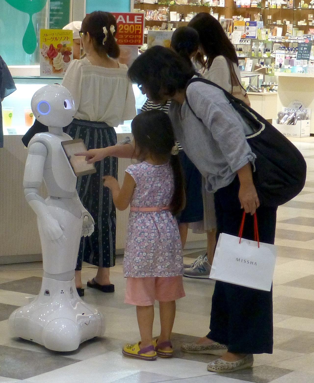Pepper, a semi-humanoid robot, providing customer service