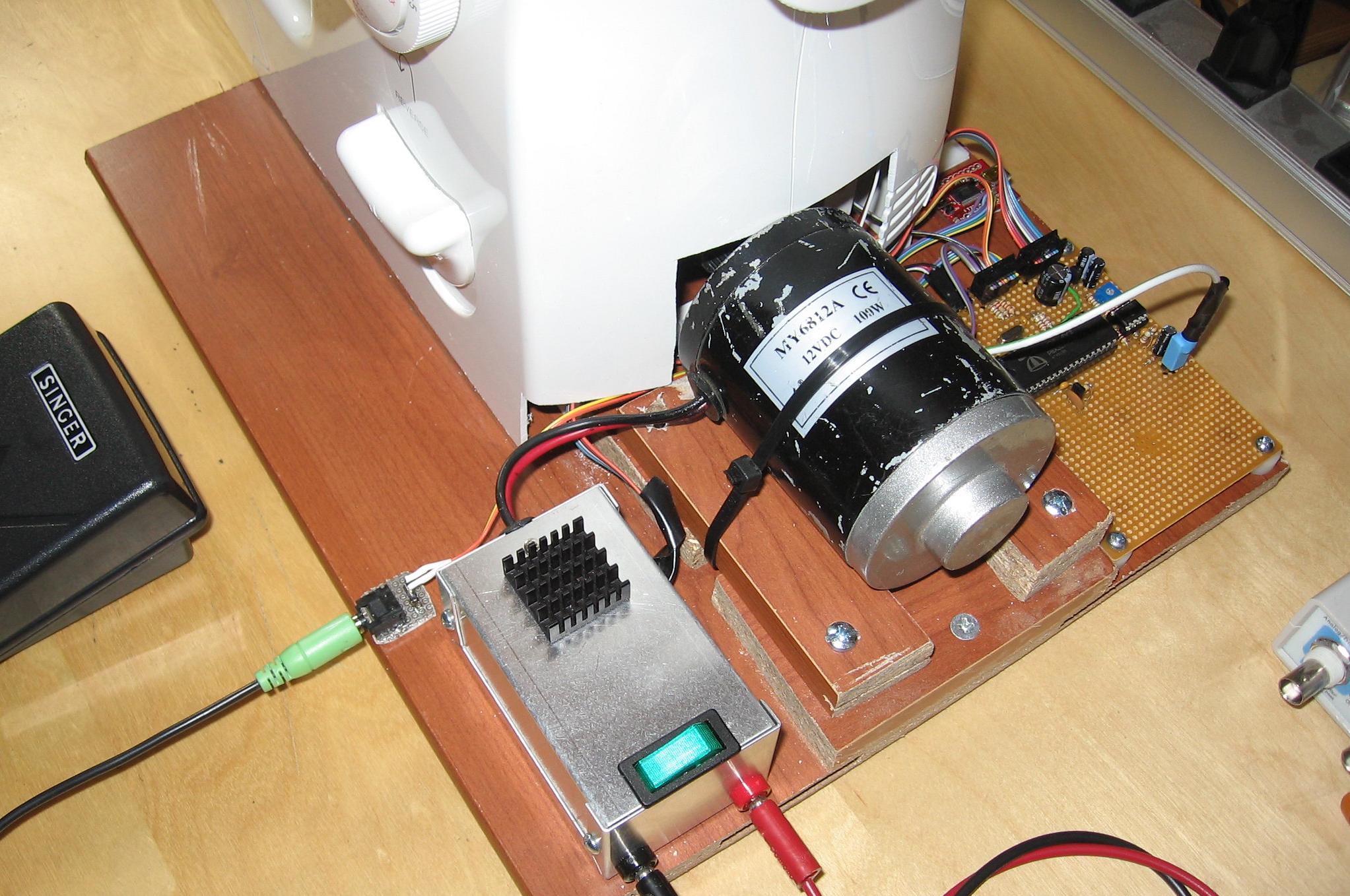 Electric motor and electronic controls for a sewing machine