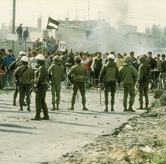 Israeli soldiers face Palestinian rioters, Gaza Strip, 1987