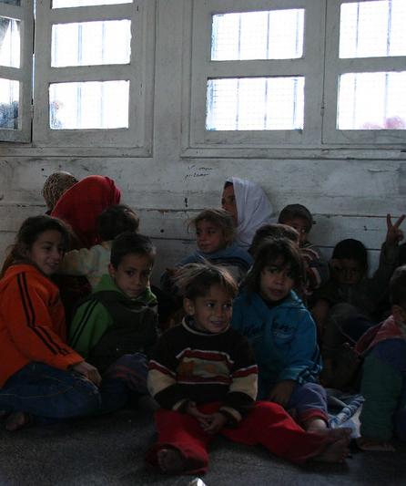 Palestinian children in Gaza shelter from Israeli bombing