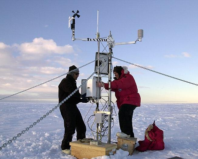 Researchers install weather and GPS instruments on an iceberg