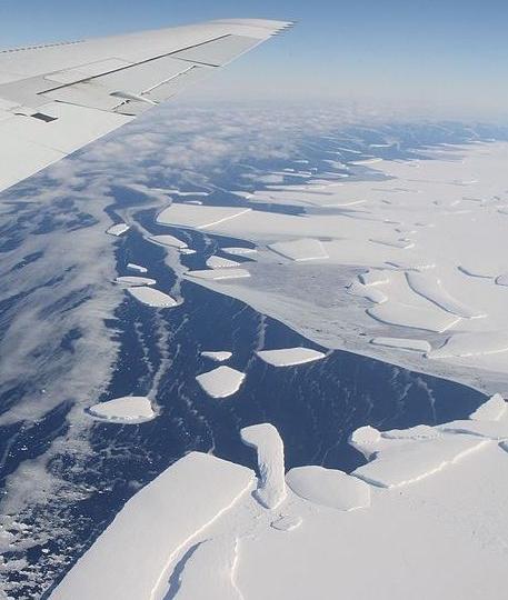 Aerial view of icebergs calving from an Antarctic ice shelf