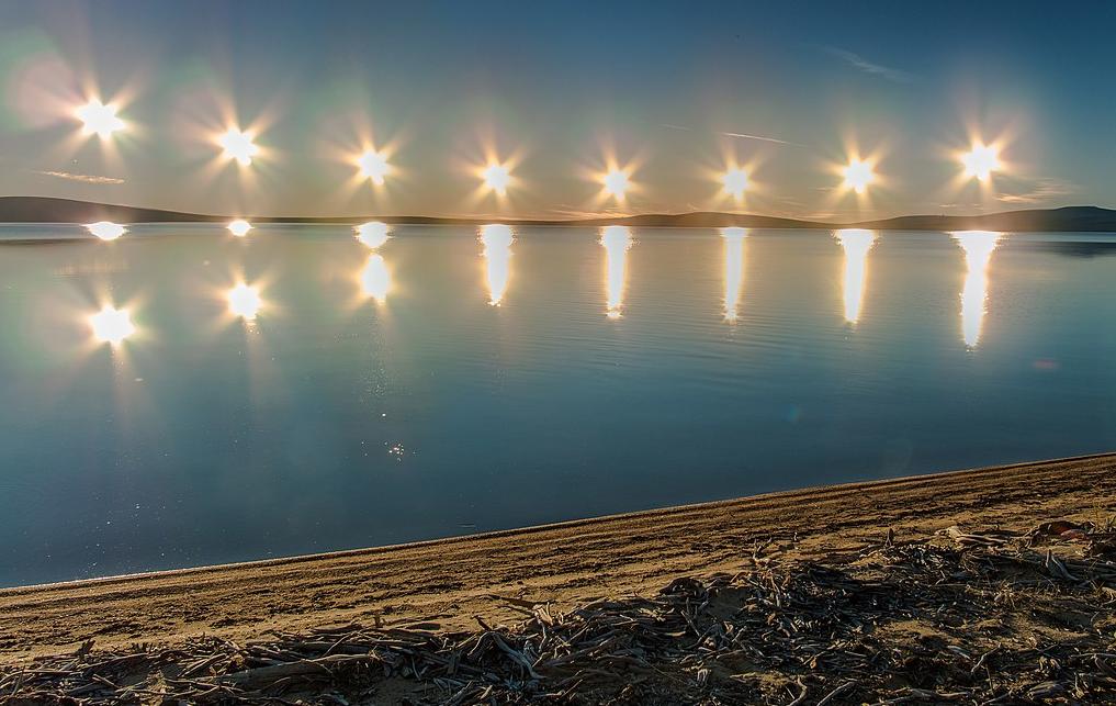 The midnight sun over Lake Ozhogino in Yakutia, Russia