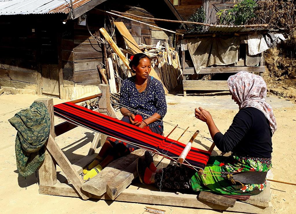 Yimkhiung Naga women weaving a traditional shawl