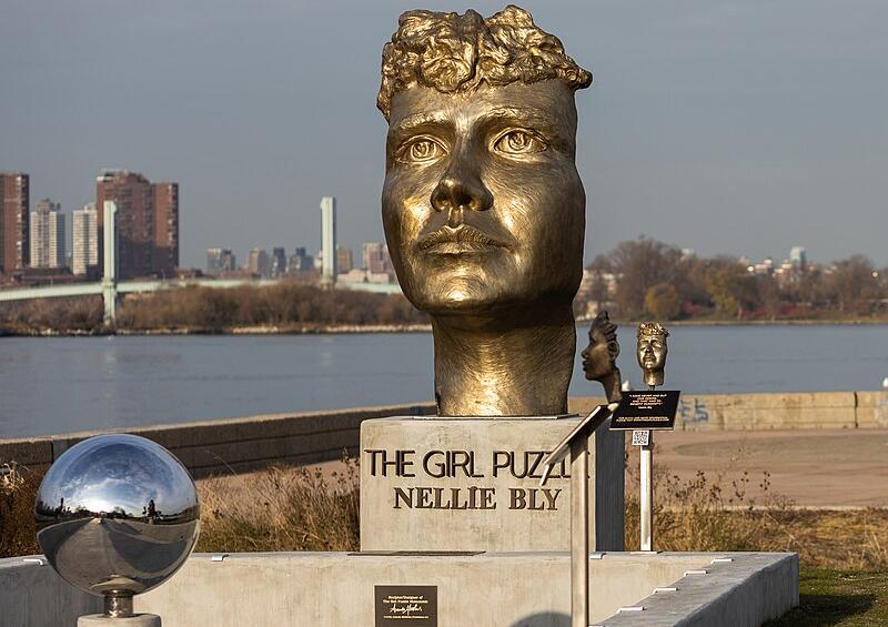 A bronze sculpture forming part of an artwork entitled "The Girl Puzzle", honouring Nellie Bly, on Roosevelt Island, Manhattan, New York City