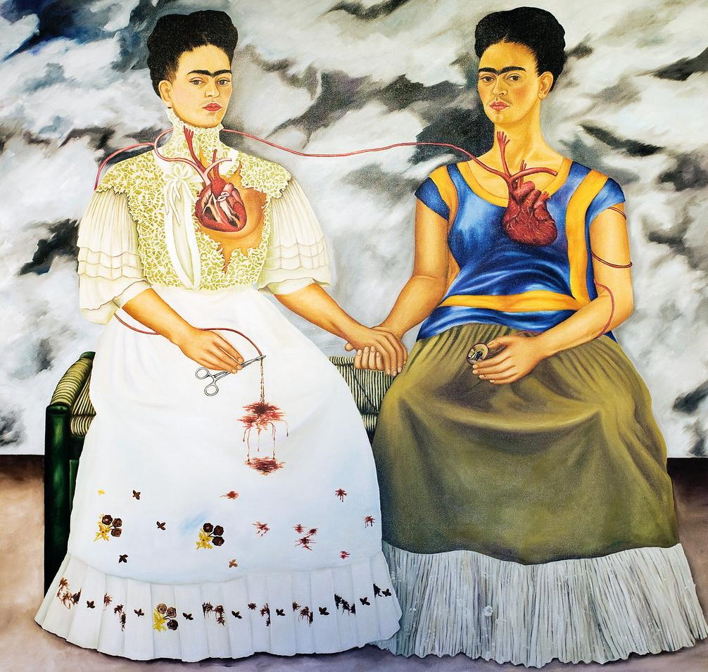 The Two Fridas (1939) shows two versions of the artist, Frida Kahlo, sitting side by side, with both of their hearts exposed.