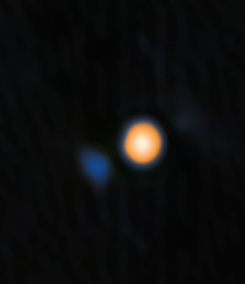 Betelgeuse, the reddish star, and Siwarha, the faint blue object