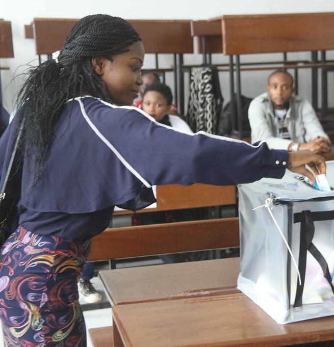 Casting a vote during the presidential election, DRC, 2018