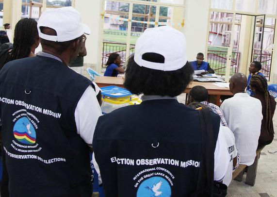 Observers at a polling station in Kinshasa, DRC