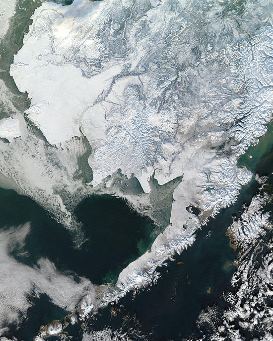 Satellite photo showing Alaska covered by snow