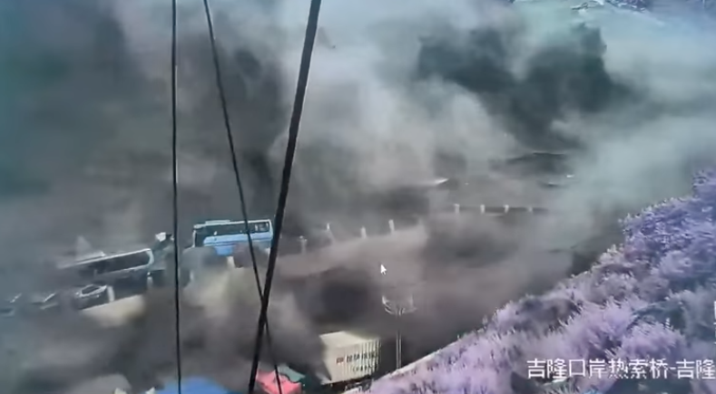 Moments after the earlier still, security camera footage shows floodwaters destroying Gyirong Port