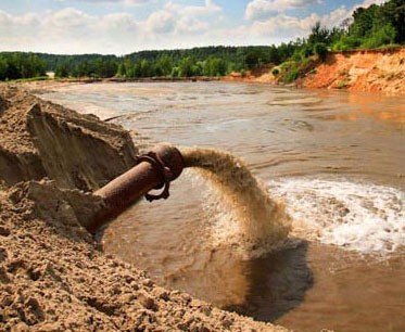 Sewage flows into a river