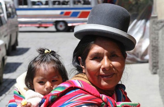 Native Indian woman carrying her baby