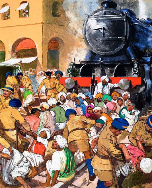Gandhi's followers lie down in front of a train.