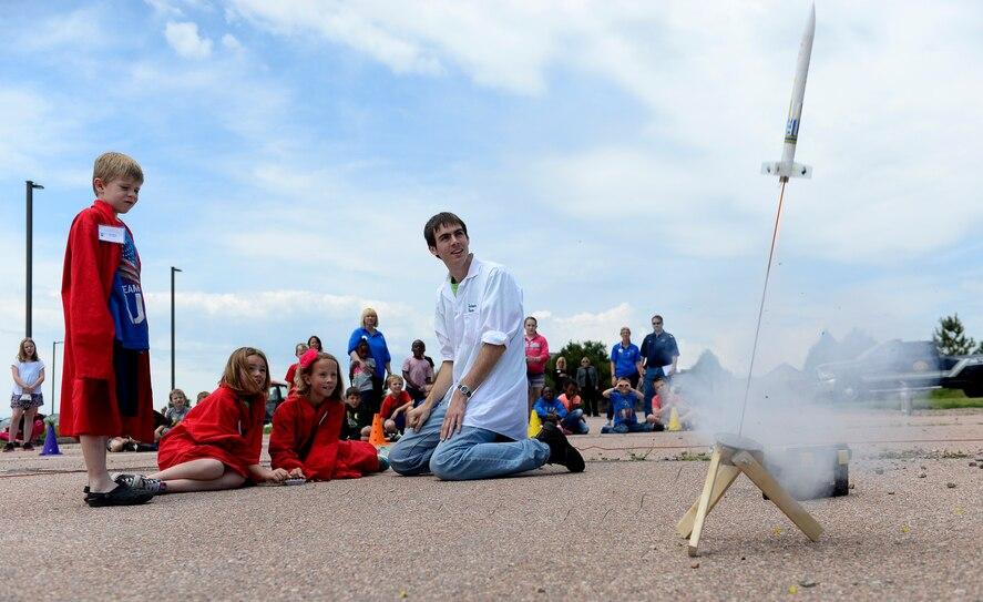 Students launch a model rocket they have just designed