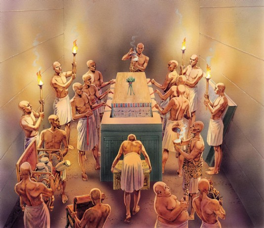 Lowering the coffin into a sarcophagus