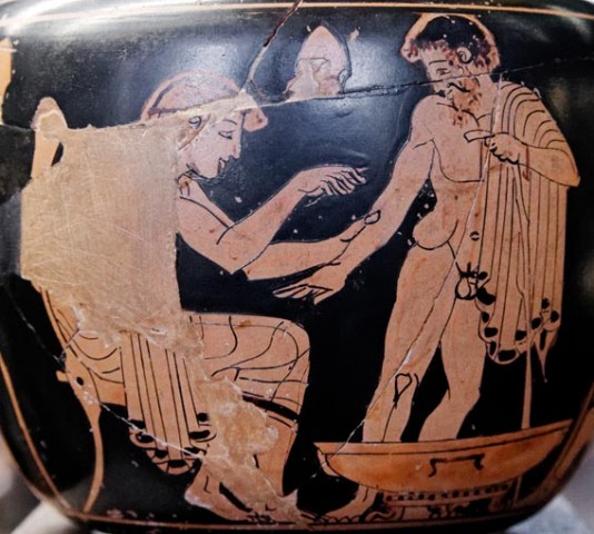 A Greek doctor (physician) treating a patient